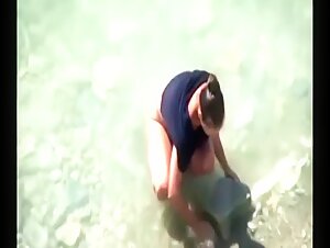 stepmother wades naked in the surf